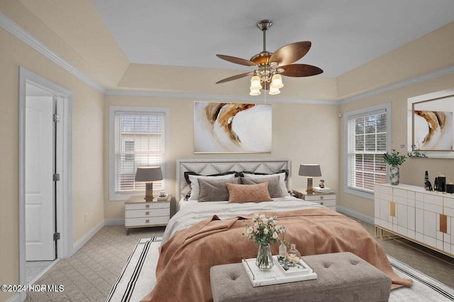 carpeted bedroom featuring ornamental molding, multiple windows, and ceiling fan