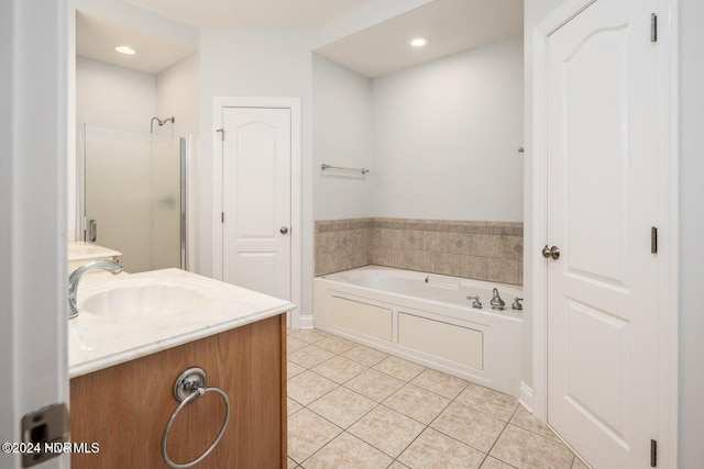 bathroom with vanity, independent shower and bath, and tile patterned flooring