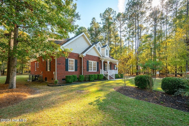 view of front of home with a front lawn and covered porch