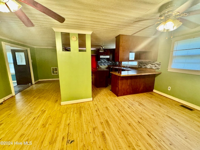 unfurnished office featuring light hardwood / wood-style floors and ceiling fan