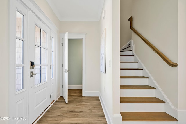 foyer entrance with light hardwood / wood-style floors