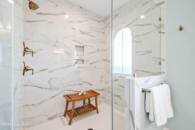 bathroom with a tile shower