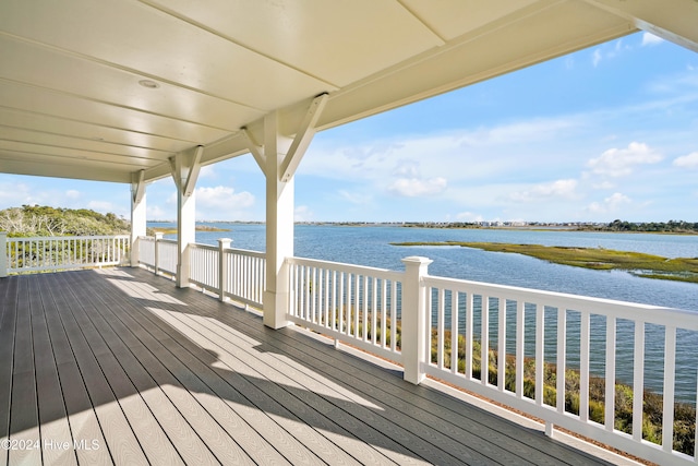 wooden deck with a water view