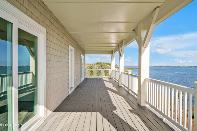 wooden terrace with a water view