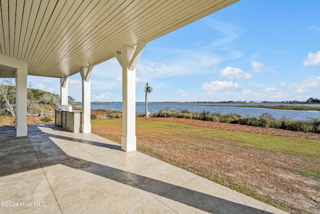 view of patio / terrace featuring a water view