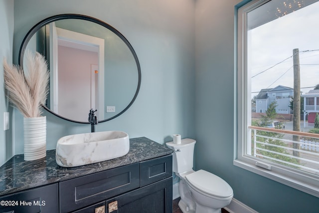 bathroom featuring vanity and toilet