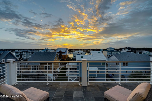 view of balcony at dusk