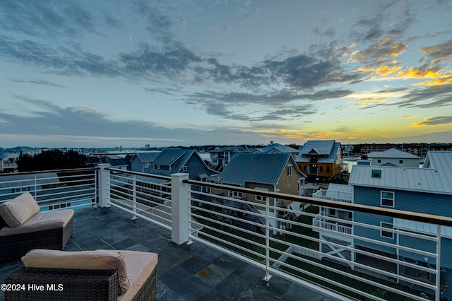 view of balcony at dusk