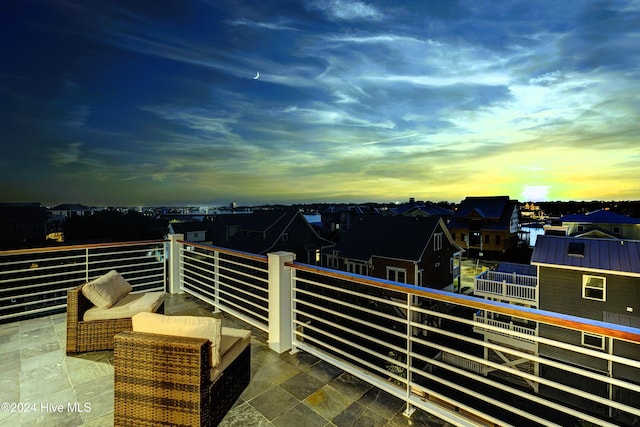 view of balcony at dusk