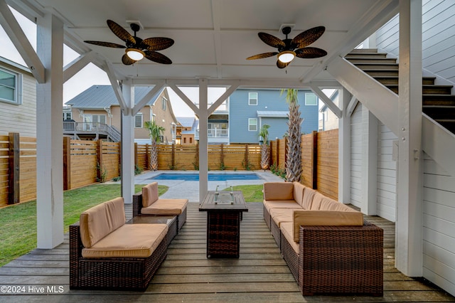 view of patio with ceiling fan, a pool side deck, and an outdoor hangout area