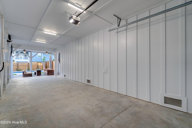 garage featuring ceiling fan and a garage door opener