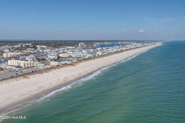 birds eye view of property featuring a view of the beach and a water view