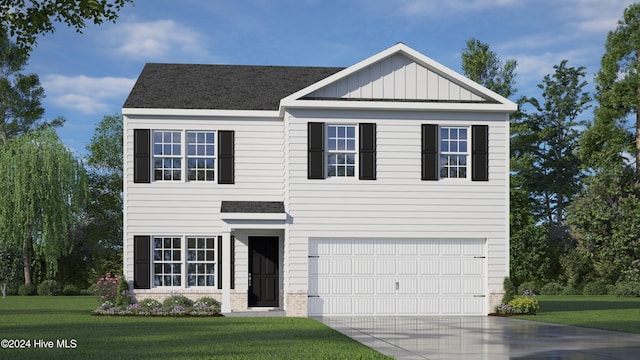 view of front of home with a front yard and a garage