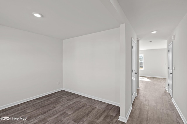 hall with dark hardwood / wood-style floors