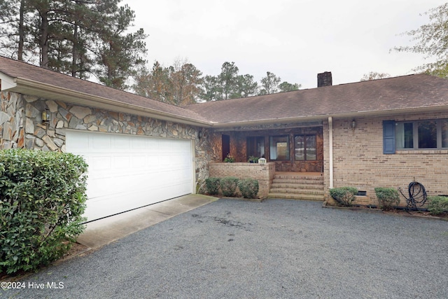 single story home with a garage