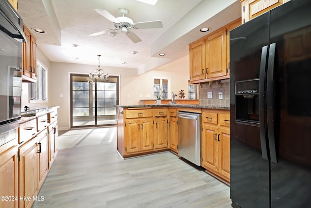 kitchen with backsplash, black refrigerator with ice dispenser, stainless steel dishwasher, light hardwood / wood-style floors, and kitchen peninsula