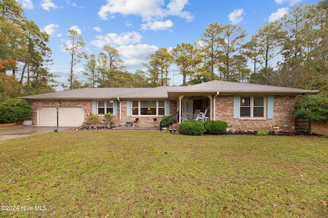 ranch-style house with a front yard and a garage