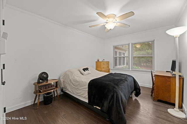 bedroom featuring ceiling fan, dark hardwood / wood-style floors, and ornamental molding