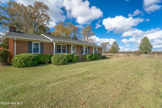 ranch-style home with a front yard