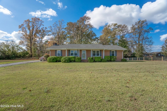 single story home with a front yard