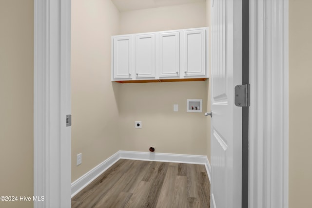 washroom with light wood-type flooring, washer hookup, cabinets, and electric dryer hookup