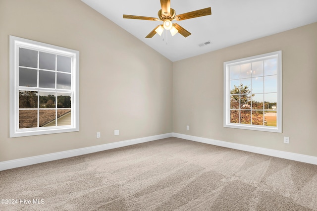 empty room with carpet floors, ceiling fan, and vaulted ceiling