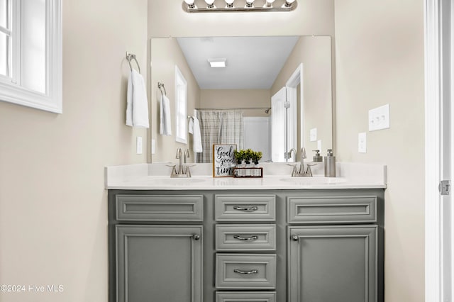 bathroom with vanity and plenty of natural light