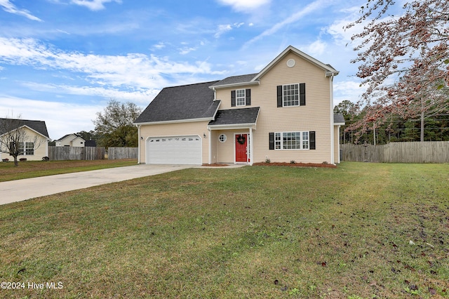 view of front property featuring a front lawn and a garage