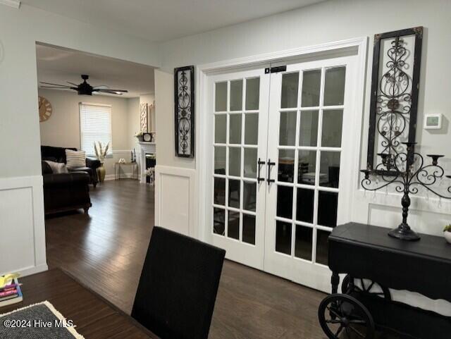 doorway to outside with ceiling fan, dark wood-type flooring, and french doors