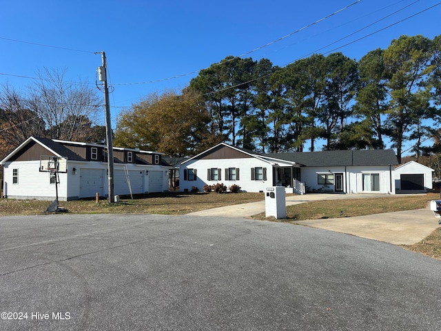 ranch-style home with a front yard and a garage