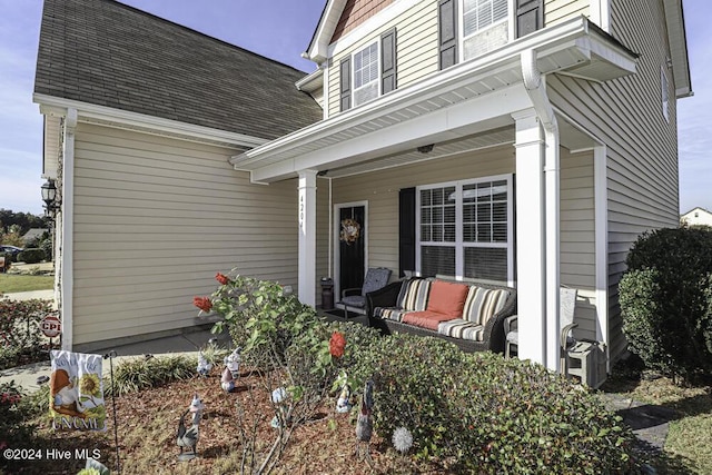 view of exterior entry featuring a porch