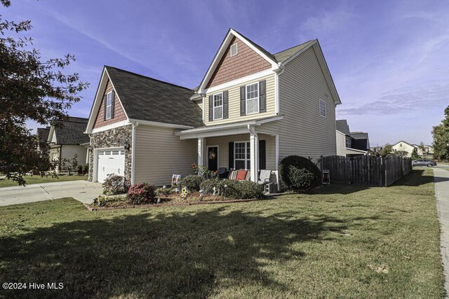 view of home's exterior with a garage, cooling unit, and a yard