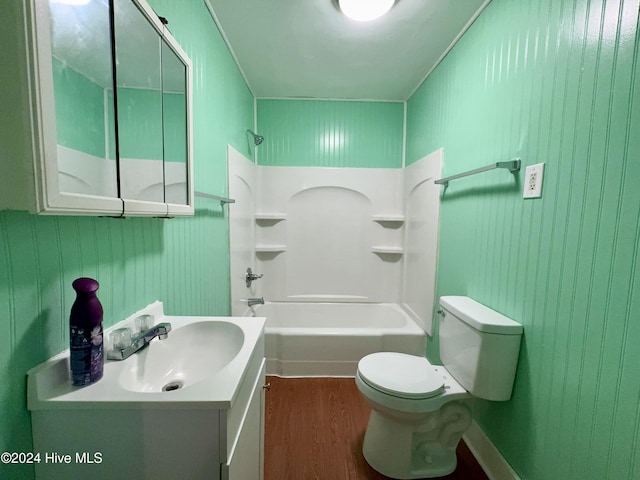 full bathroom featuring shower / bathing tub combination, wood-type flooring, vanity, and toilet