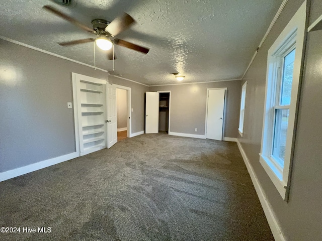 unfurnished bedroom featuring carpet flooring, ceiling fan, crown molding, and a textured ceiling