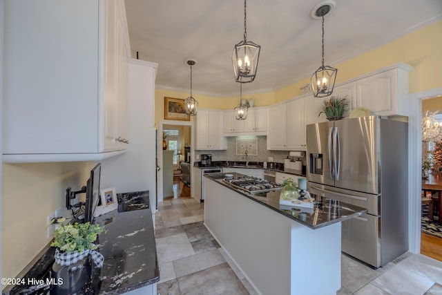 kitchen with stainless steel appliances, a sink, white cabinetry, backsplash, and crown molding