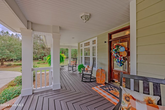 wooden terrace with a porch