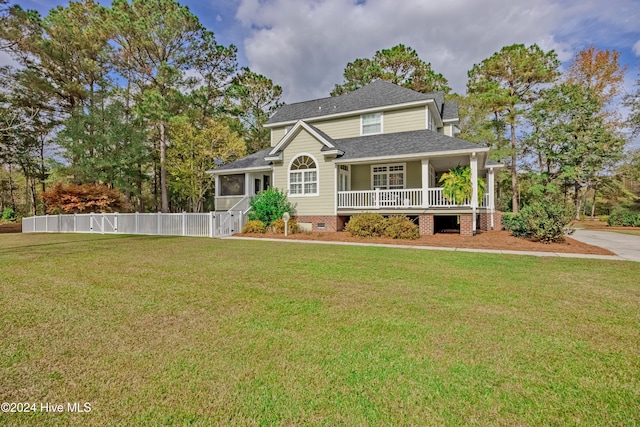 view of front of house with a shingled roof, crawl space, fence, a front lawn, and a porch