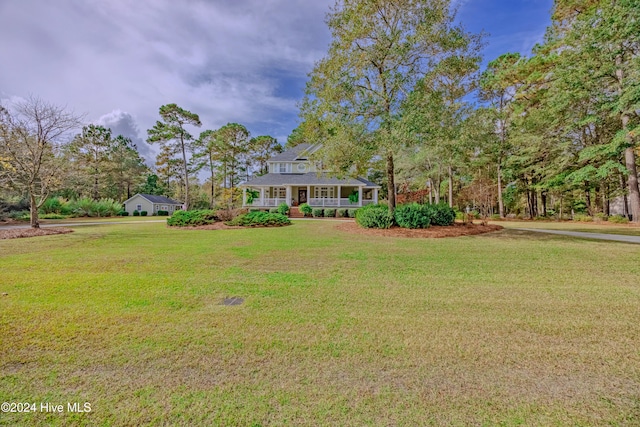 view of yard with covered porch