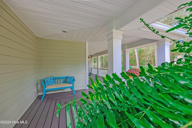 wooden terrace featuring covered porch