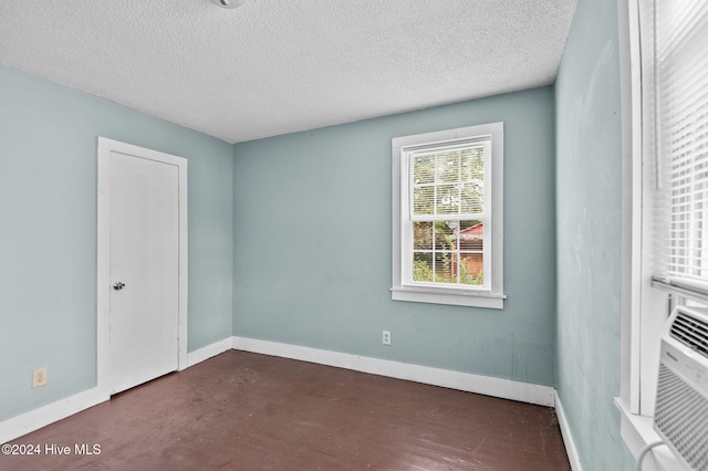 spare room featuring a textured ceiling