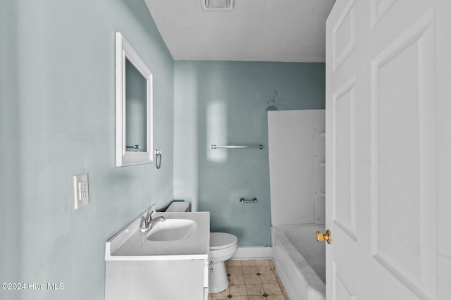 bathroom featuring vanity, washtub / shower combination, baseboards, tile patterned flooring, and toilet