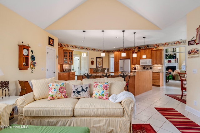 tiled living room with vaulted ceiling