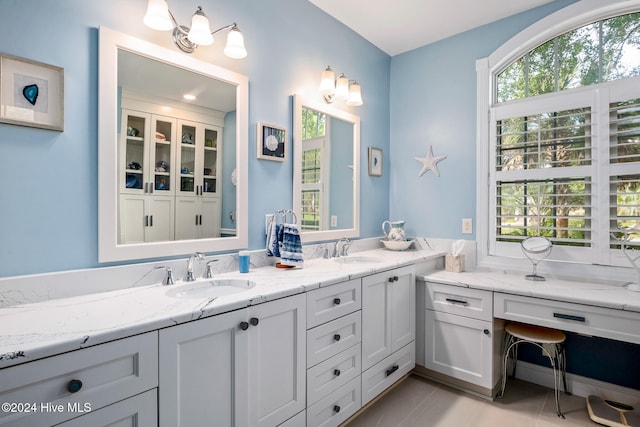 bathroom featuring vanity, a wealth of natural light, and tile patterned floors