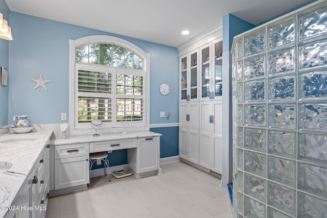 bathroom featuring a wealth of natural light and vanity