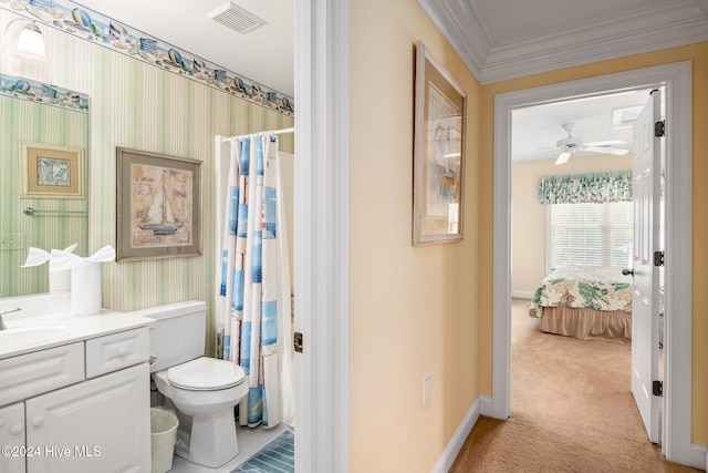 bathroom featuring toilet, curtained shower, ornamental molding, vanity, and ceiling fan