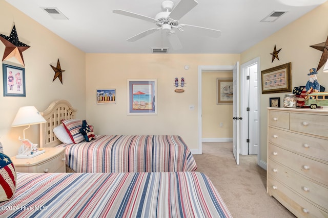 bedroom with light colored carpet and ceiling fan