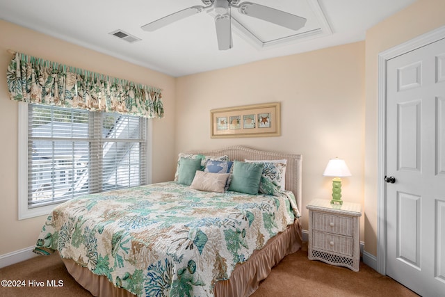 bedroom featuring ceiling fan and carpet