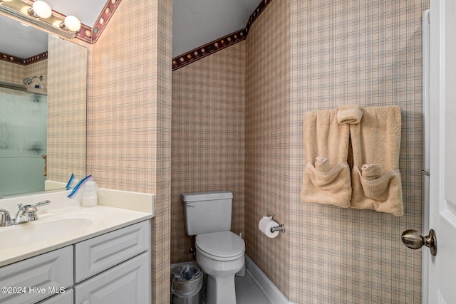 bathroom featuring toilet and vanity