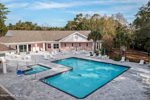 view of swimming pool with a patio area