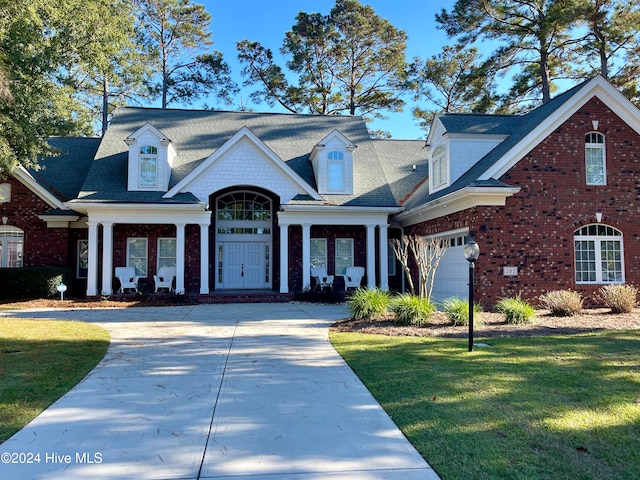 view of front facade with a garage and a front yard